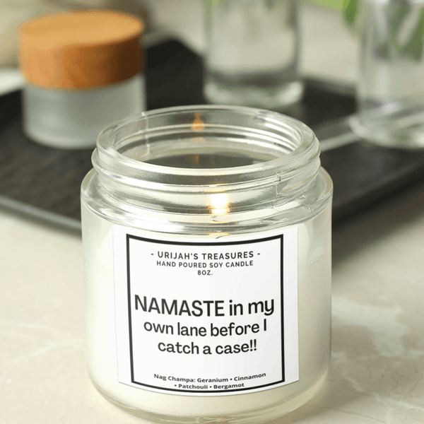 https://urijahstreasures.com/cdn/shop/products/namaste-stay-in-my-own-lane-before-i-catch-a-case-8oz-soy-candle-568671_grande.png?v=1679121334